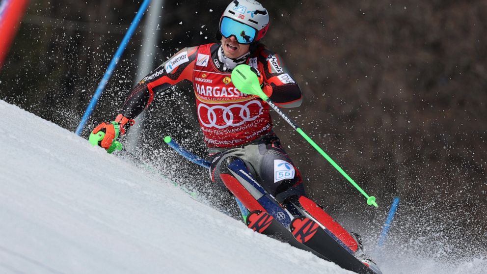 Norway's Henrik Kristoffersen speeds down the course during an alpine ski, men's World Cup slalom, in Meribel, France, Sunday, March 20, 2022. (AP Photo/Marco Trovati)
