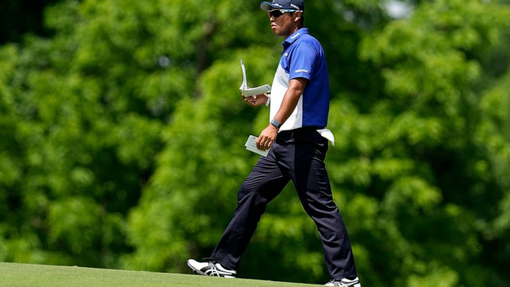 Hideki Matsuyama, of Japan, walks on the ninth fairway during the first round of the Memorial golf tournament, Thursday, June 2, 2022, in Dublin, Ohio. (AP Photo/Darron Cummings)