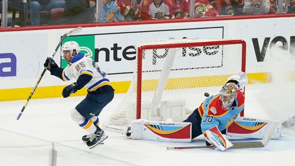 St. Louis Blues center Jordan Kyrou (25) scores the game winning goal against Florida Panthers goaltender Spencer Knight (30)during overtime of an NHL hockey game, Saturday, Nov. 26, 2022, in Sunrise, Fla. The Blues defeated the Panthers 5-4. (AP Pho