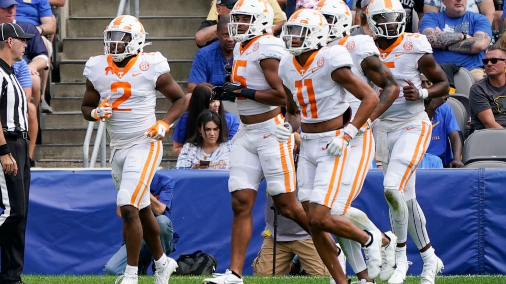 Tennessee running back Jabari Small (2), leads his team from the field after he scored a touchdown against Pittsburgh during the first half of an NCAA college football game, Saturday, Sept. 10, 2022, in Pittsburgh. (AP Photo/Keith Srakocic)