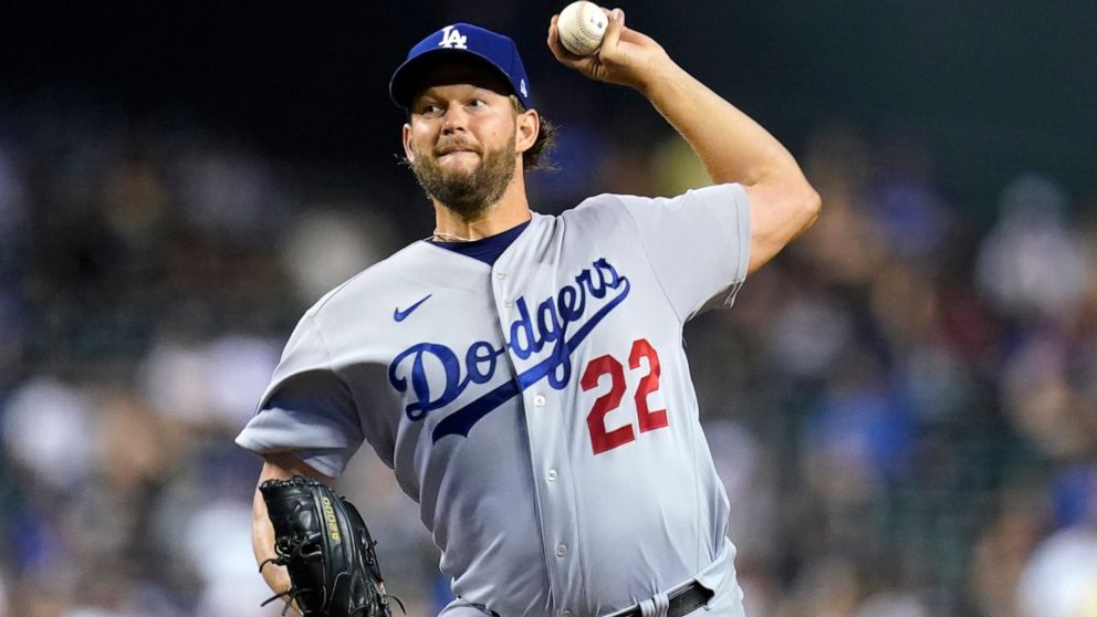 Los Angeles Dodgers starting pitcher Clayton Kershaw throws to an Arizona Diamondbacks batter during the first inning of a baseball game in Phoenix, Tuesday, Sept. 13, 2022. (AP Photo/Ross D. Franklin)