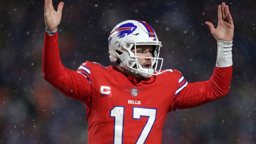 Buffalo Bills quarterback Josh Allen (17) celebrates after diving for a two-point conversion during the second half of an NFL football game against the Miami Dolphins in Orchard Park, N.Y., Saturday, Dec. 17, 2022. (AP Photo/Joshua Bessex)