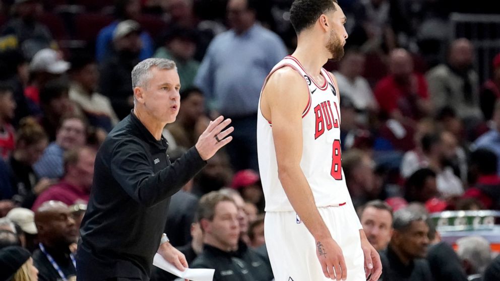 Chicago Bulls head coach Billy Donovan talks to Zach LaVine during the first half of an NBA basketball game against the Boston Celtics Monday, Oct. 24, 2022, in Chicago. The Bulls won 120-102. (AP Photo/Charles Rex Arbogast)