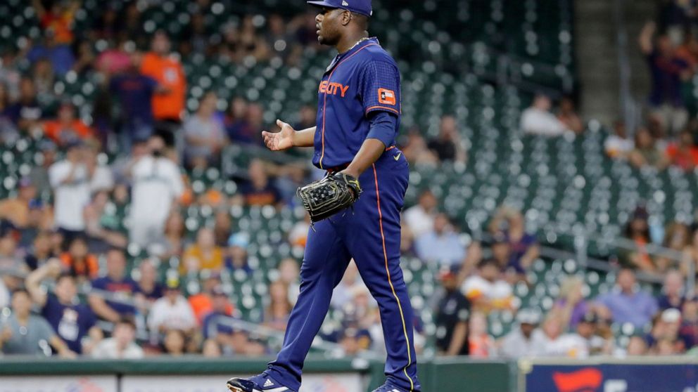 Houston Astros relief pitcher Hector Neris, reacts on the mound after being ejected for throwing at the head of Seattle Mariners batter Eugenio Suarez during the ninth inning of a baseball game Monday, June 6, 2022, in Houston. The ejection happened 