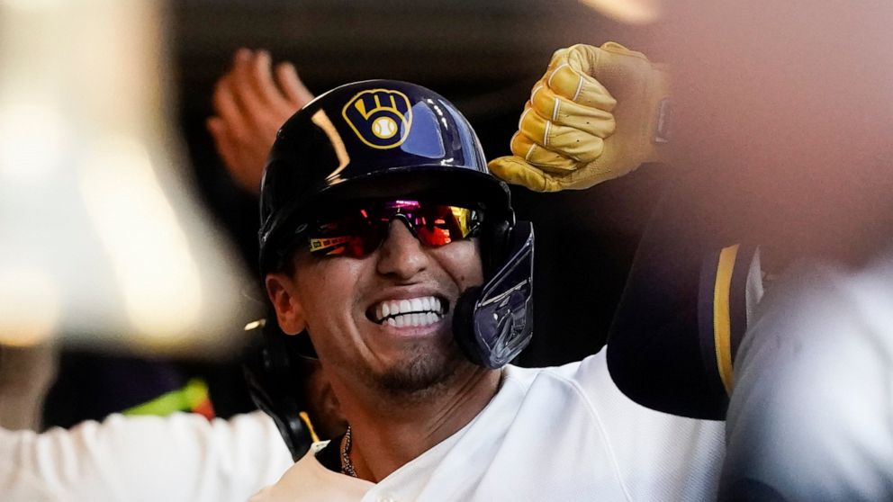 Milwaukee Brewers' Tyrone Taylor is congratulated after hitting a three-run home run during the fourth inning of a baseball game against the St. Louis Cardinals Thursday, June 23, 2022, in Milwaukee. (AP Photo/Morry Gash)