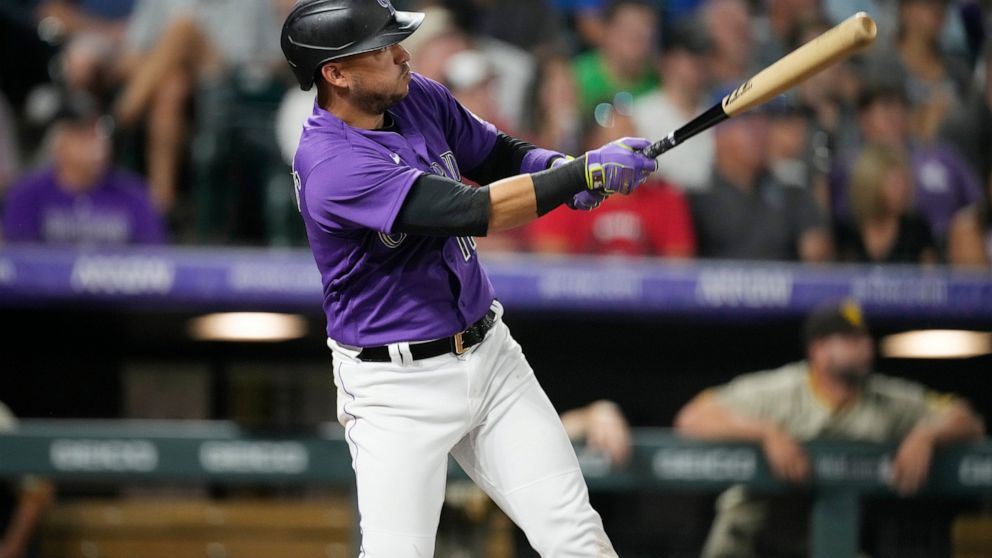 Colorado Rockies' Jose Iglesias watches his three-run home run off San Diego Padres relief pitcher Nabil Crismatt during the sixth inning of a baseball game Wednesday, July 13, 2022, in Denver. (AP Photo/David Zalubowski)