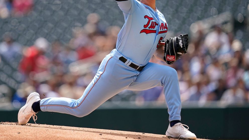 Minnesota Twins starting pitcher Tyler Mahle delivers against the Kansas City Royals during the first inning of a baseball game Wednesday, Aug. 17, 2022, in Minneapolis. (AP Photo/Abbie Parr)
