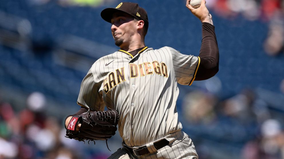 San Diego Padres starting pitcher Blake Snell throws during the second inning of a baseball game against the Washington Nationals, Sunday, Aug. 14, 2022, in Washington. (AP Photo/Nick Wass)
