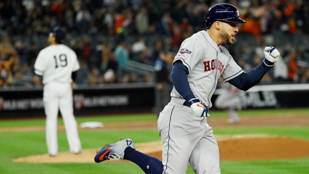 Houston Astros' George Springer, right, celebrates after his three-run home run off New York Yankees starting pitcher Masahiro Tanaka during the third inning in Game 4 of baseball's American League Championship Series Thursday, Oct. 17, 2019, in New 