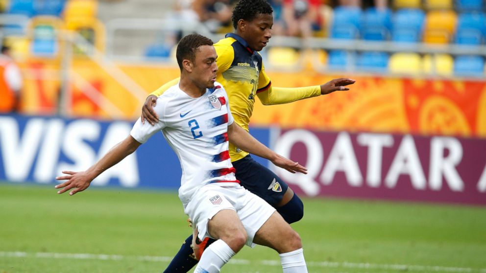 FILE - In this June 8, 2019, file photo, United States' Sergino Dest, left, and Ecuador's Gonzalo Plata challenge for the ball during a quarterfinal soccer match at the U20 World Cup in Gdynia, Poland. Sergiño Dest is set to become the first American