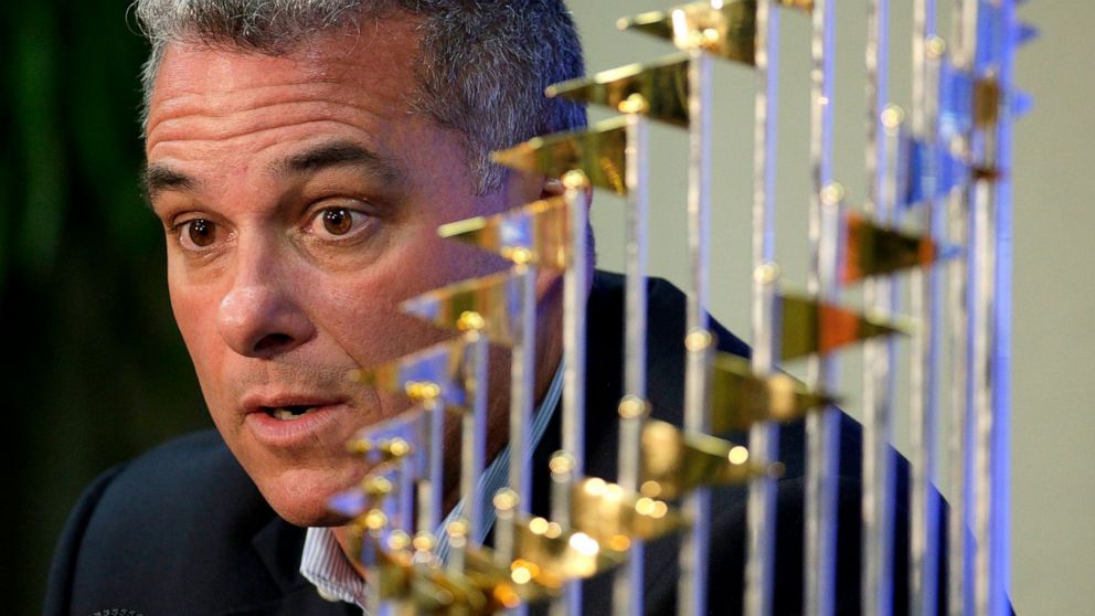 FILE - Kansas City Royals general manager Dayton Moore speaks to members of the media alongside the Royals' World Series trophy during a news conference wrapping up the team's season, in Kansas City, Mo., Nov. 5, 2015. The Kansas City Royals, Wednesd