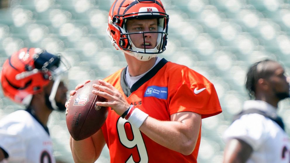 FILE - Cincinnati Bengals quarterback Joe Burrow (9) takes part in drills at the team's NFL football stadium, Tuesday, June 14, 2022, in Cincinnati. Bengals owner Mike Brown said the team already has an eye on structuring finances so they can pay Joe
