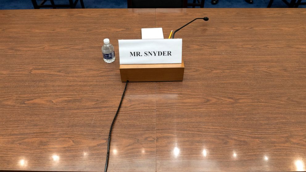 A placard for Dan Snyder, owner of the Washington Commanders football team, is seen, Wednesday, June 22, 2022, during a Hous​e Oversight Committee hearing on the Washington Commanders' workplace conduct, on Capitol Hill in Washington. Snyder did not 