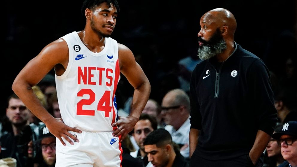 Brooklyn Nets head coach Jacque Vaughn talks to Cam Thomas (24) during the second half of an NBA basketball game against the San Antonio Spurs, Monday, Jan. 2, 2023, in New York. The Nets won 139-103. (AP Photo/Frank Franklin II)