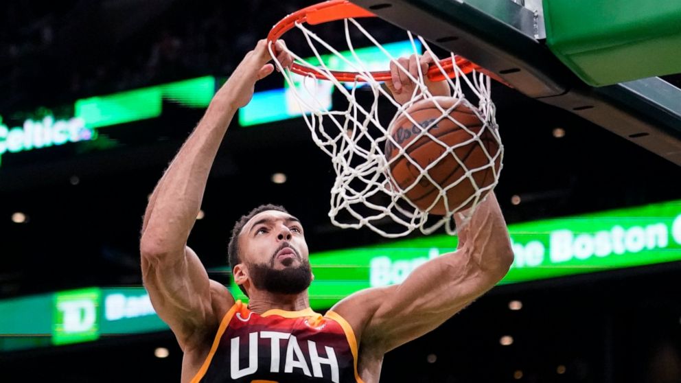 Utah Jazz center Rudy Gobert dunks during the first half of the team's NBA basketball game against the Boston Celtics, Wednesday, March 23, 2022, in Boston. (AP Photo/Charles Krupa)