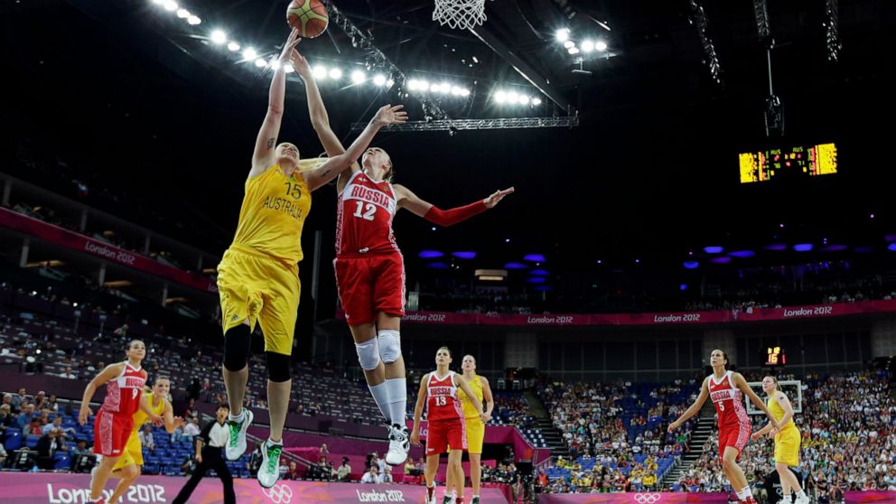 FILE - Australia's Lauren Jackson (15) drives to the basket as Russia's Irina Osipova (12) defends during a women's bronze medal basketball game at the 2012 Summer Olympics, Saturday, Aug. 11, 2012, in London. Jackson is savoring every minute of her 