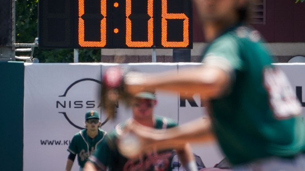 FILE - A pitch clock is deployed to restrict pitcher preparation times during a minor league baseball game between the Brooklyn Cyclones and Greensboro Grasshoppers, July 13, 2022, in the Coney Island neighborhood of the Brooklyn borough of New York.