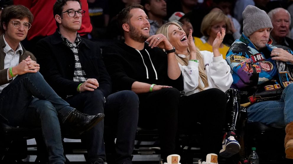 Los Angeles Rams quarterback Matthew Stafford, third from left, and his wife Kelly Stafford, second from right, watch the Golden State Warriors take on the Los Angeles Lakers in an NBA basketball game in Los Angeles, Saturday, March 5, 2022. (AP Phot