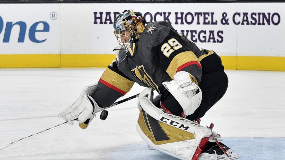 Vegas Golden Knights goaltender Marc-Andre Fleury defends against the Chicago Blackhawks during the first period of an NHL hockey game, Tuesday, Dec. 10, 2019, in Las Vegas. (AP Photo/David Becker)