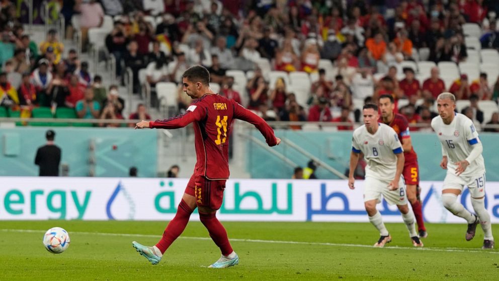 Spain's Ferran Torres scores a penalty, the third goal of his team, during the World Cup group E soccer match between Spain and Costa Rica, at the Al Thumama Stadium in Doha, Qatar, Wednesday, Nov. 23, 2022. (AP Photo/Alessandra Tarantino)