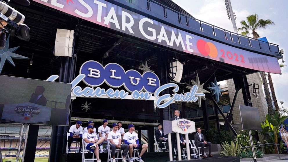 Los Angele mayor Eric Garcetti, right, speaks as members of the Los Angeles Dodgers look on during an event to officially launch the countdown to MLB All-Star Week Tuesday, May 3, 2022, at Dodger Stadium in Los Angeles. The All-Star Game is scheduled