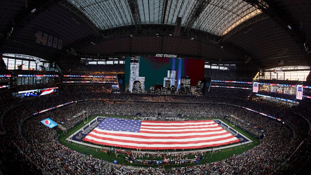 A view of the New York skyline with a tribute to Sept. 11, is shown on the large video screen during the playing of the national anthem before the first half of a NFL football game between the Tampa Bay Buccaneers and Dallas Cowboys in Arlington, Tex
