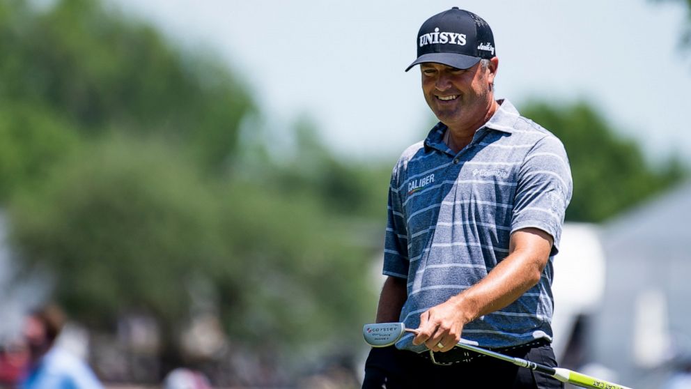 Ryan Palmer cracks a smile after chipping to the ninth hole during the second round of the AT&T Byron Nelson golf tournament in McKinney, Texas, on Friday, May 13, 2022. (AP Photo/Emil Lippe)