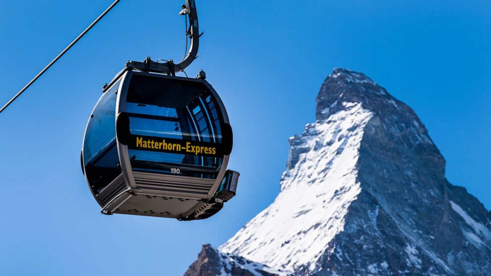 The 'Matterhorn-Express' gondola lift is pictured in front of Matterhorn mountain in the ski resort Zermatt, Switzerland, Wednesday, March 18, 2020. On March 16 the Swiss authorities proclaimed a state of emergency until April 19, 2020 in an effort t