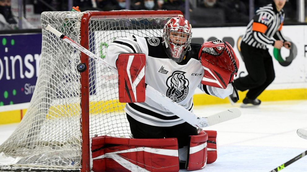 Gatineau Olympiques goaltender Eve Gascon makes a save against the Rimouski Oceanic during the first period of a QMJHL hockey game in Gatineau, Quebec, Saturday, March 19, 2022. (Justin Tang/The Canadian Press via AP)