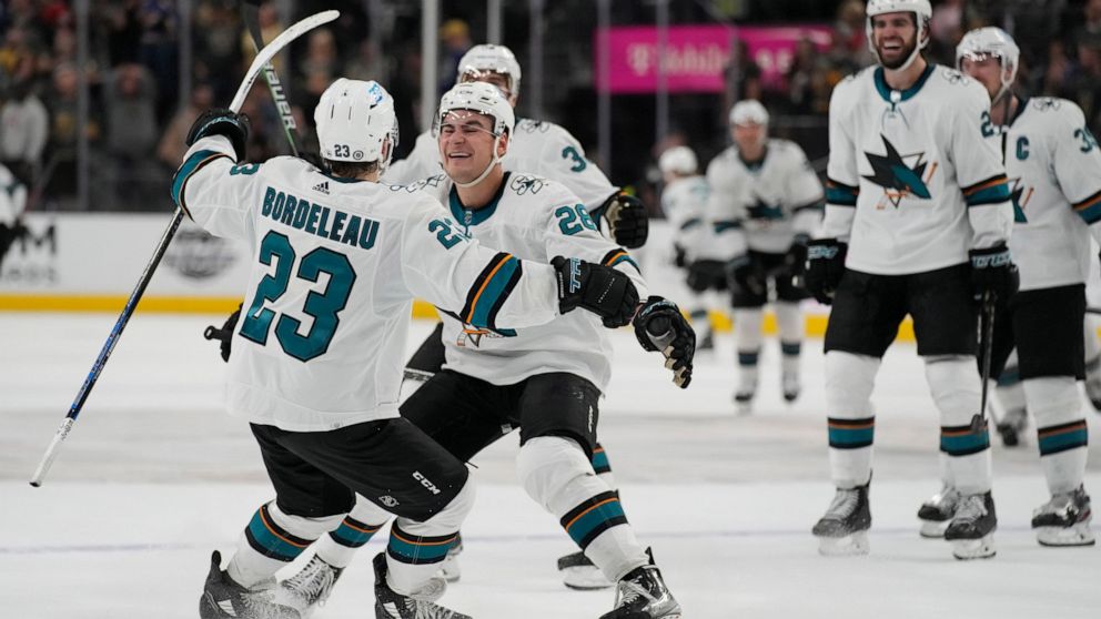 San Jose Sharks right wing Timo Meier (28) celebrates after Thomas Bordeleau (23) scored against the Vegas Golden Knights during a shootout in an NHL hockey game Sunday, April 24, 2022, in Las Vegas. (AP Photo/John Locher)