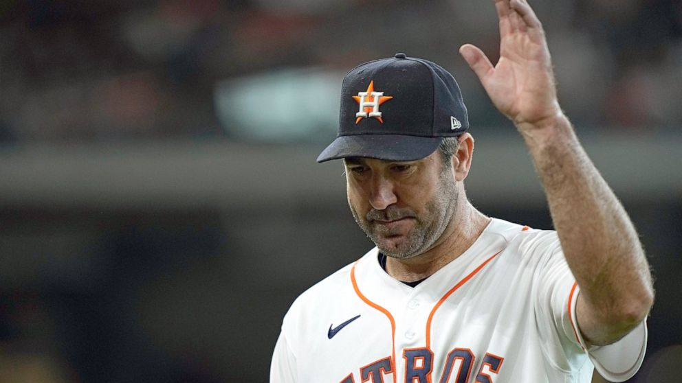 Houston Astros starting pitcher Justin Verlander acknowledges the crowd as he leaves the field during the seventh inning of a baseball game against the Seattle Mariners Wednesday, May 4, 2022, in Houston. (AP Photo/David J. Phillip)