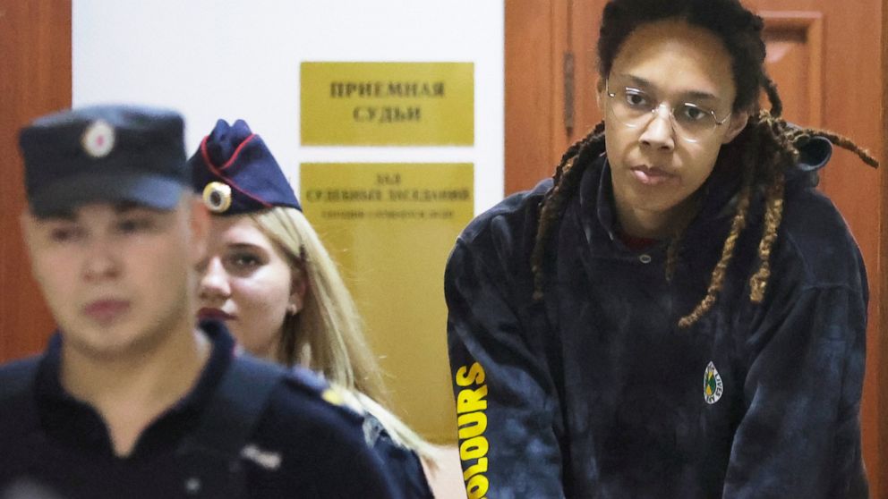 WNBA star and two-time Olympic gold medalist Brittney Griner is escorted to a courtroom for a hearing, in Khimki just outside Moscow, Russia, Monday, July 25, 2022. American basketball star Brittney Griner returns Tuesday to a Russian courtroom for h