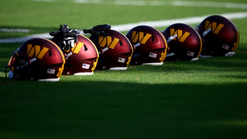 FILE- Washington Commanders helmets sit on the field during practice at the team's NFL football training facility, Monday, Aug. 1, 2022 in Ashburn, Va. The congressional investigation of the NFL's Washington Commanders will end when Republicans take 
