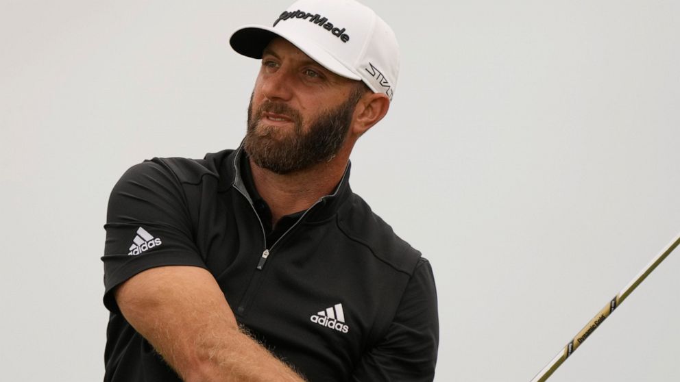 Dustin Johnson of the US watches his shot along the 11th fairway during the second round of the British Open golf championship on the Old Course at St. Andrews, Scotland, Friday July 15, 2022. The Open Championship returns to the home of golf on July