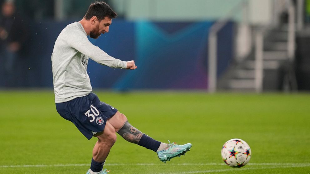PSG's Lionel Messi kicks the ball in the warm-up prior to the Champions League group H soccer match between Juventus and Paris Saint Germain at the Allianz stadium in Turin, Italy, Wednesday, Nov. 2, 2022. (AP Photo/Antonio Calanni)