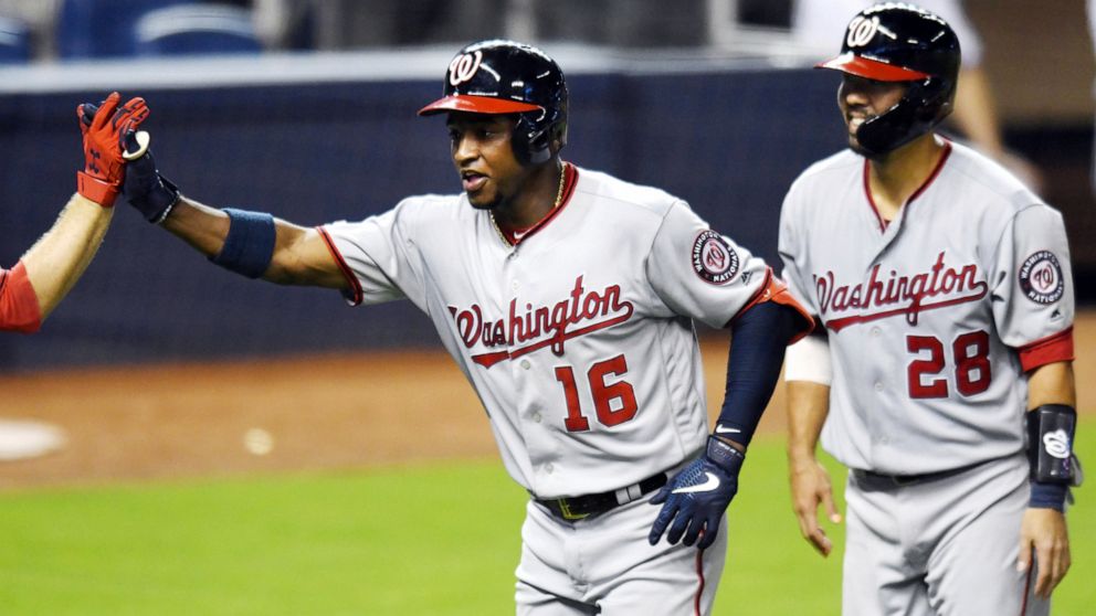 Washington Nationals' Victor Robles (16) celebrates his two-run home run against the Miami Marlins with Kurt Suzuki, right, during the sixth inning of a baseball game Thursday, June 27, 2019, in Miami. (AP Photo/Jim Rassol)