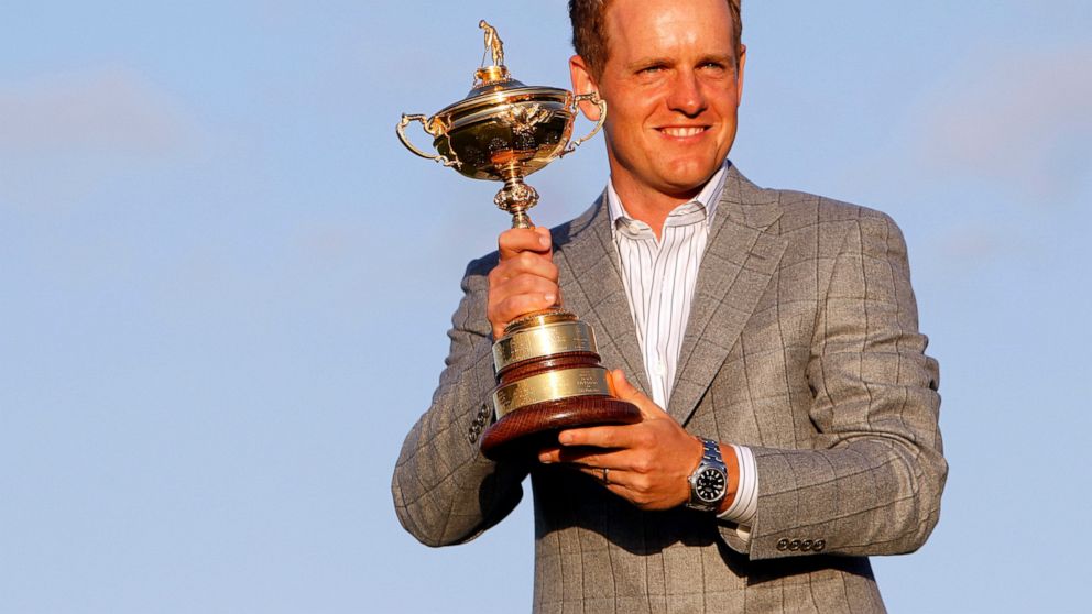 FILE - Europe's Luke Donald holds the Ryder Cup after Europe defeated the United States on the final day of the 2010 Ryder Cup golf matches at the Celtic Manor Resort in Newport, Wales, on Oct. 4, 2010. Donald has been selected Ryder Cup captain for 