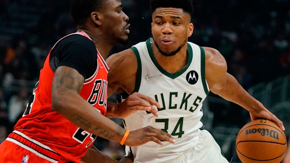 Milwaukee Bucks' Giannis Antetokounmpo drives past Chicago Bulls' Javonte Green during the first half of an NBA basketball game Tuesday, March 22, 2022, in Milwaukee . (AP Photo/Morry Gash)