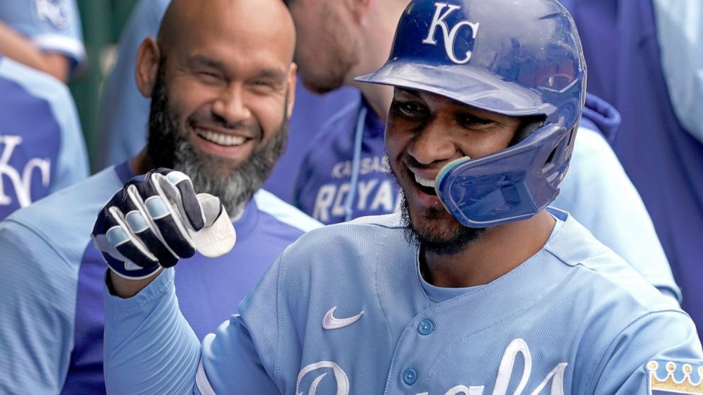Kansas City Royals' Edward Olivares celebrates in the dugout after hitting a solo home run during the fourth inning of a baseball game against the Minnesota Twins Thursday, Sept. 22, 2022, in Kansas City, Mo. (AP Photo/Charlie Riedel)