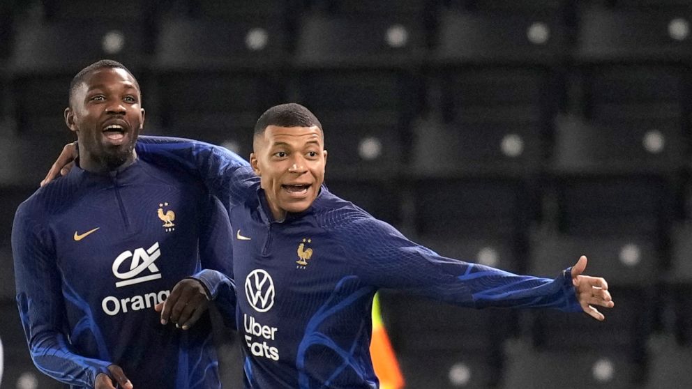 France's Kylian Mbappe, right, and Marcus Thuram, practise during a training session at the Jassim Bin Hamad stadium in Doha, Qatar, Friday, Dec. 16, 2022. France will play against Argentina during their World Cup final soccer match on Dec. 18. (AP P