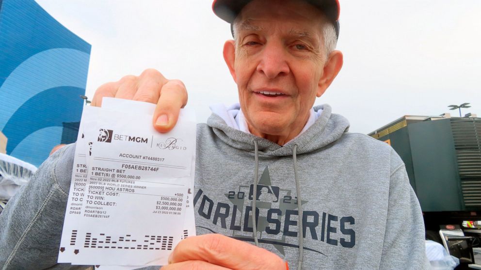 Jim "Mattress Mack" McIngvale, of Houston, holds some of the tickets in Atlantic City N.J., Tuesday, Nov. 1, 2022, showing bets he has made on the Houston Astros to win the baseball World Series. A prolific gambler with a knack for attention-getting 