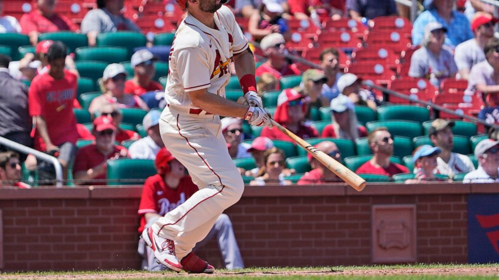 St. Louis Cardinals' Paul Goldschmidt watches his two-run home run during the second inning of a baseball game against the Cincinnati Reds Saturday, July 16, 2022, in St. Louis. (AP Photo/Jeff Roberson)