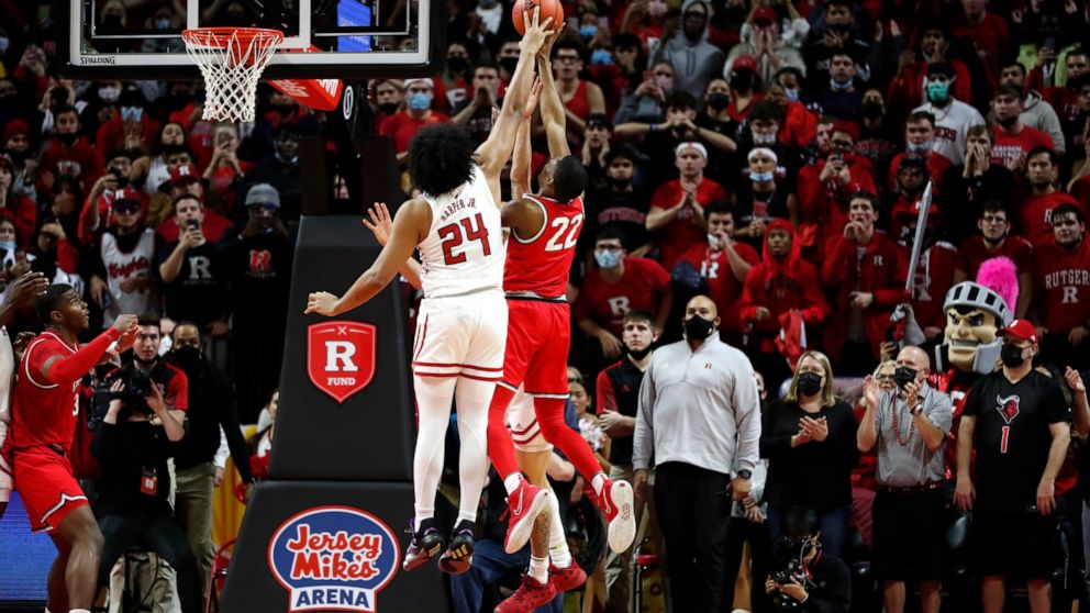 Rutgers guard Caleb McConnell (22) blocks the shot of Ohio State guard Malaki Branham (22) during the second half of an NCAA college basketball game in Piscataway, N.J., Wednesday, Feb. 9, 2022. Rutgers won 66-64. (AP Photo/Noah K. Murray)