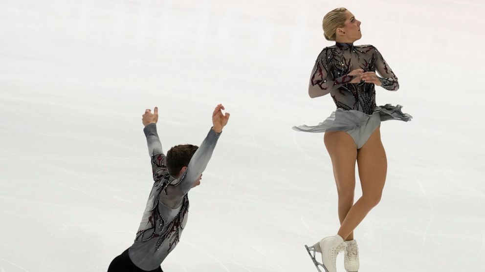 American pairs figure skaters Alexa Knierim and Brandon Frazier compete in the pairs' short program during the figure skating Grand Prix finals at the Palavela ice arena, in Turin, Italy, Thursday, Dec. 8, 2022. (AP Photo/Antonio Calanni)