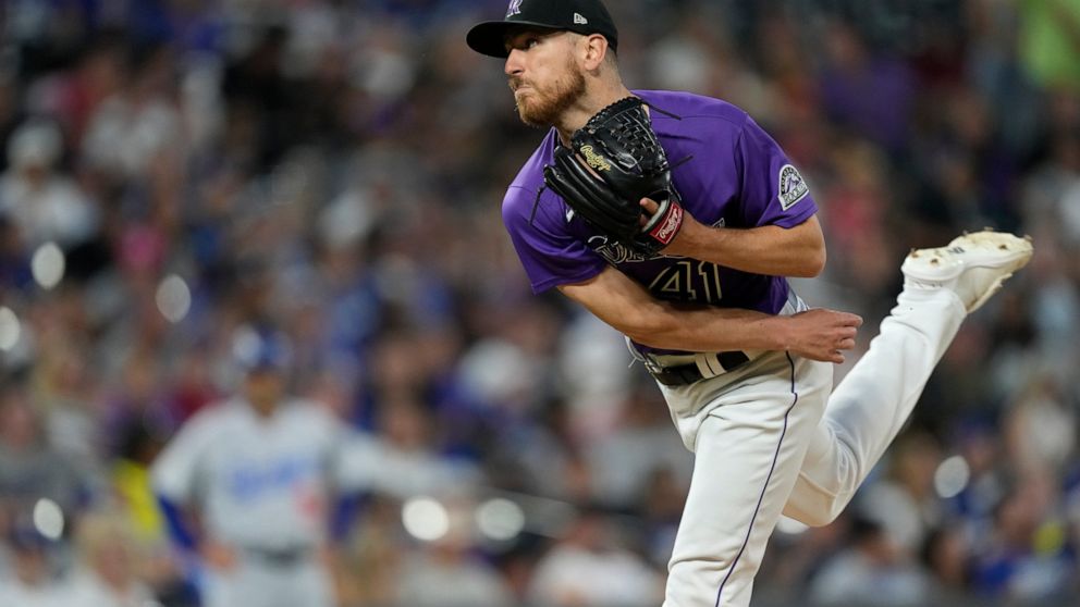 Colorado Rockies starting pitcher Chad Kuhl works against the Los Angeles Dodgers during the eighth inning of a baseball game Monday, June 27, 2022, in Denver. (AP Photo/David Zalubowski)