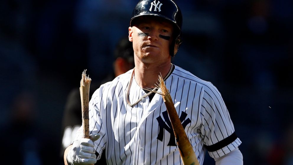 New York Yankees' Clint Frazier walks back to the dugout with a broken bat after striking out to end the ninth inning of a baseball game against the Kansas City Royals on Sunday, April 21, 2019, in New York. (AP Photo/Adam Hunger)