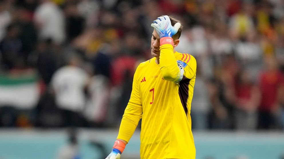 Germany's goalkeeper Manuel Neuer reacts at the end of the World Cup group E soccer match between Spain and Germany, at the Al Bayt Stadium in Al Khor , Qatar, Sunday, Nov. 27, 2022. The match ended in a 1-1 draw. (AP Photo/Matthias Schrader)