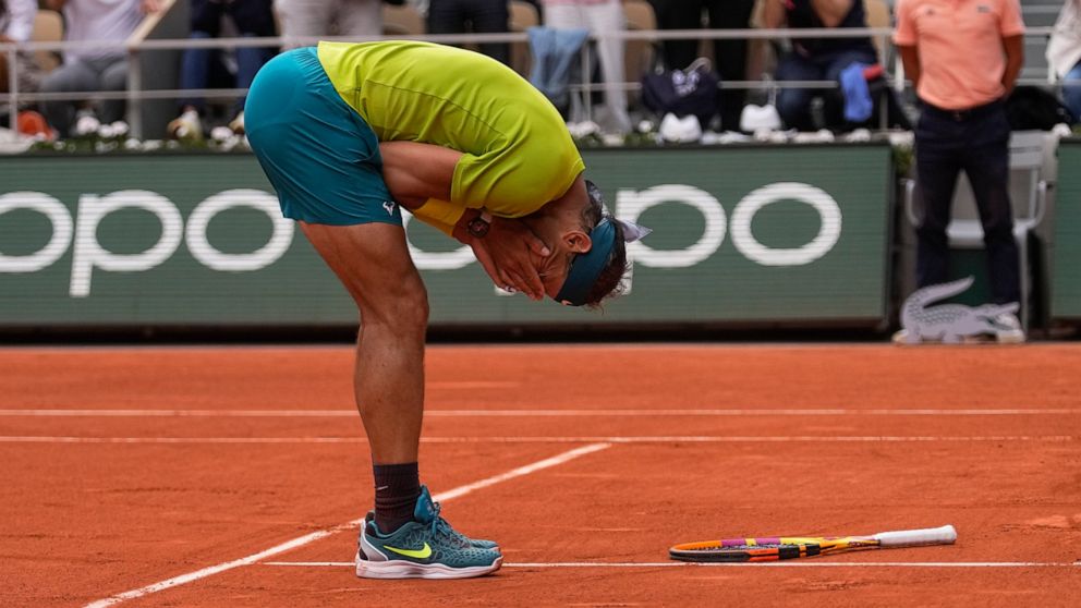 Spain's Rafael Nadal celebrates winning the final match against Norway's Casper Ruud in three sets, 6-3, 6-3, 6-0, at the French Open tennis tournament in Roland Garros stadium in Paris, France, Sunday, June 5, 2022. (AP Photo/Michel Euler)
