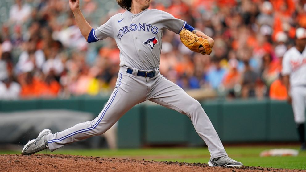 Toronto Blue Jays starting pitcher Kevin Gausman throws a pitch to the Baltimore Orioles during the third inning of the first game of a baseball doubleheader, Monday, Sept. 5, 2022, in Baltimore. (AP Photo/Julio Cortez)