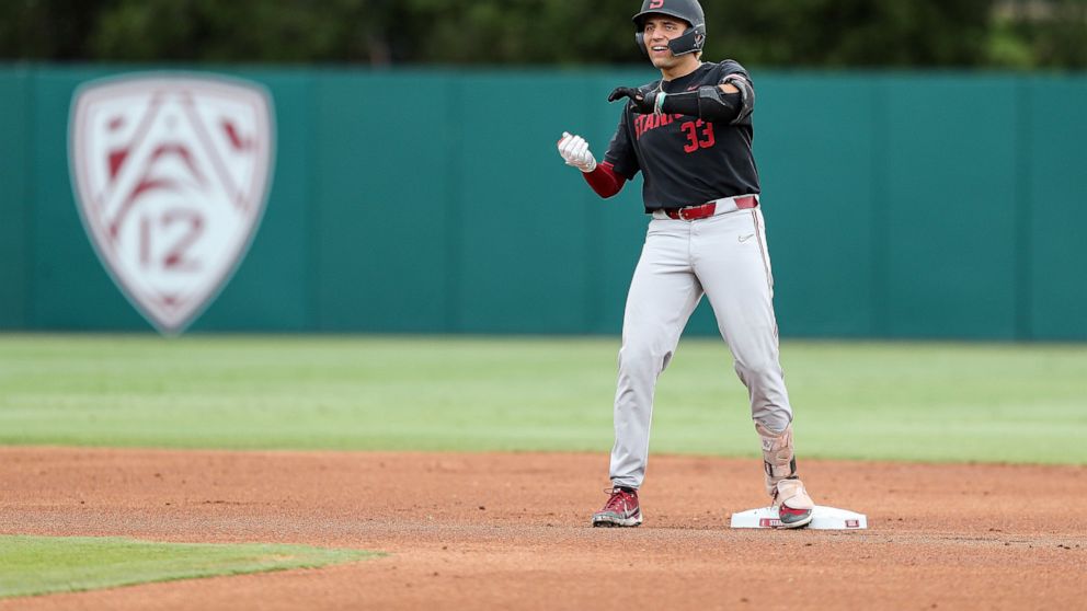 Stanford's Brett Barrera celebrates a double against Connecticut during the first inning of an NCAA college baseball super regional game on Sunday, June 12, 2022, in Stanford, Calif. (AP Photo/Kavin Mistry)